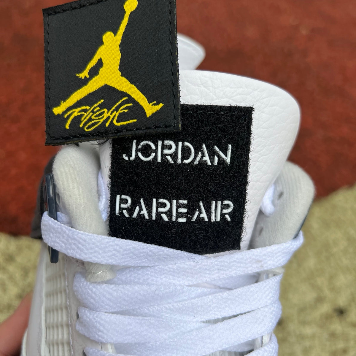 Nike Air Jordan 4 Retro Rare Air Tour Yellow sneakers, side view showing the yellow and gray colorway and classic design.