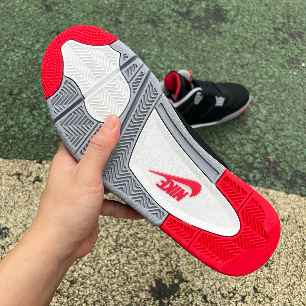 Nike Air Jordan 4 Retro OG Bred sneakers in black and red, featuring classic design and iconic style from the Nike x Jordan collection.