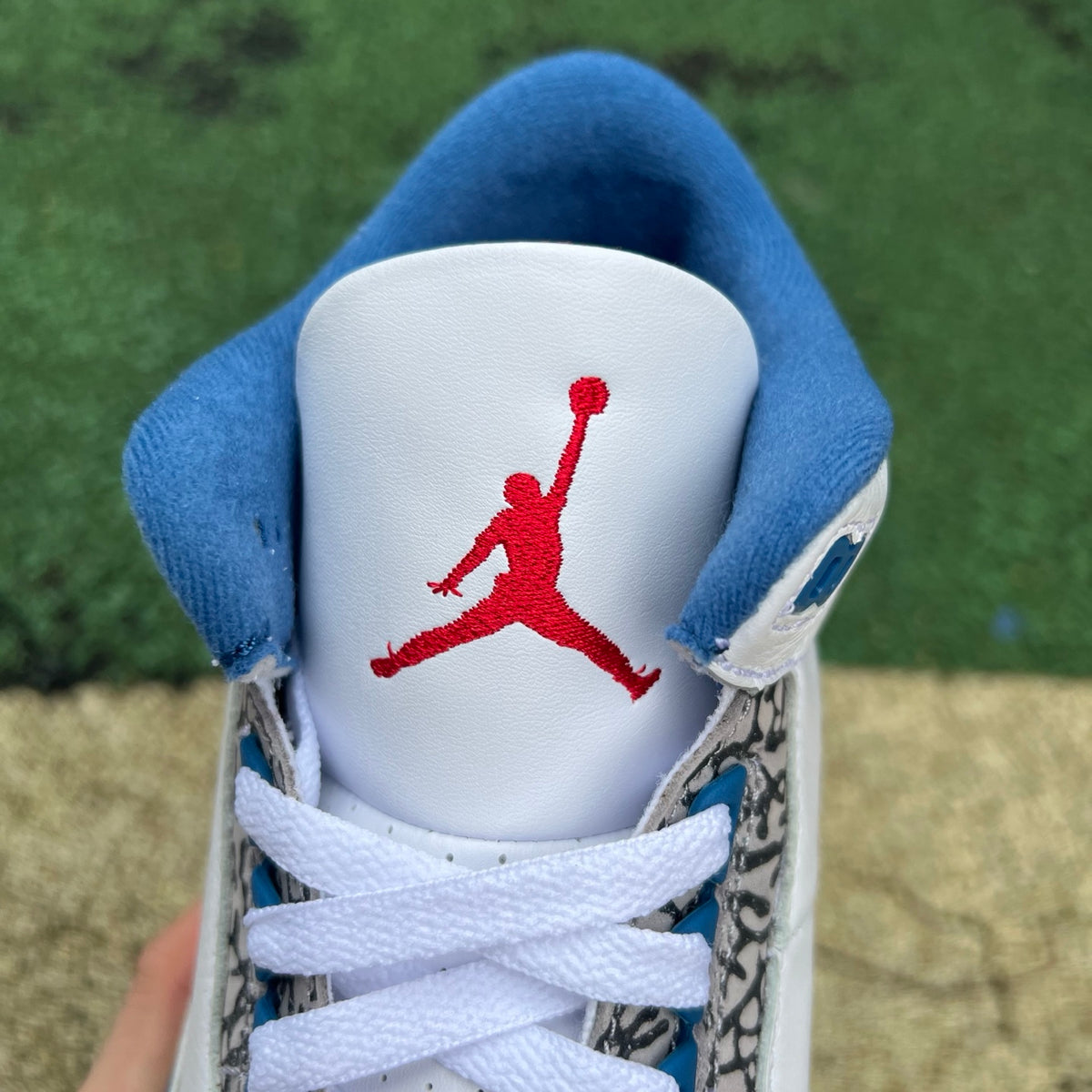 Nike Air Jordan 3 Retro True Blue sneakers featuring a blue and white leather design with Nike and Jordan branding.