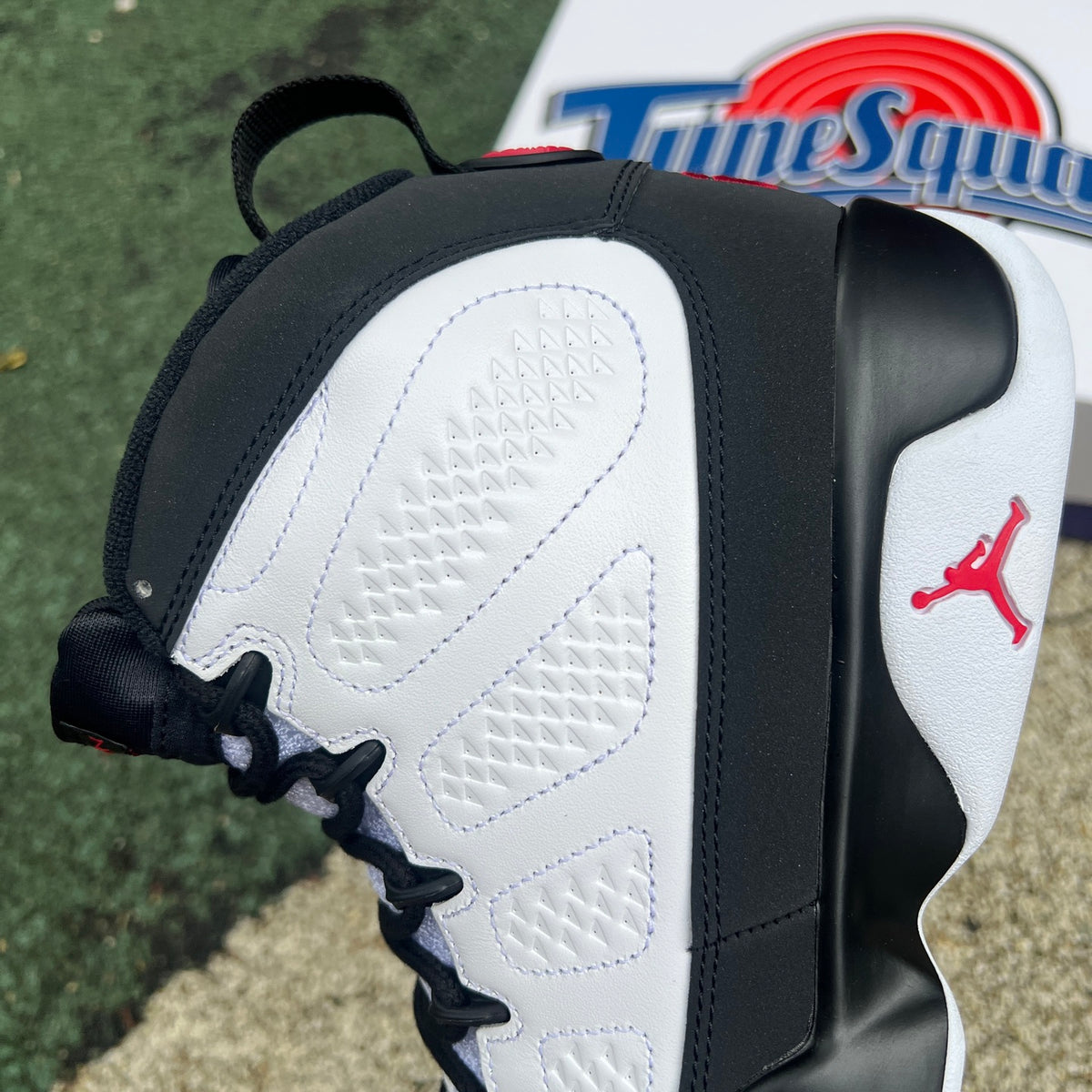 Nike Air Jordan 9 Retro OG Space Jam sneakers in black with space-themed design and white accents, displayed on a plain background.