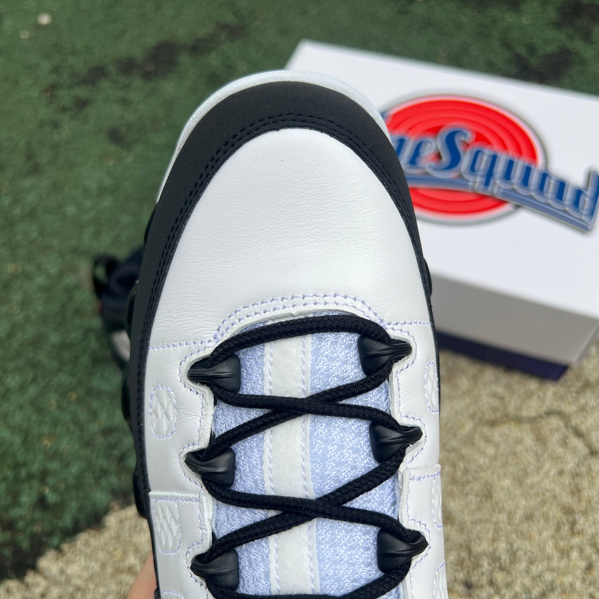 Nike Air Jordan 9 Retro OG Space Jam sneakers in black and blue with white accents, showcasing the iconic design and branding.