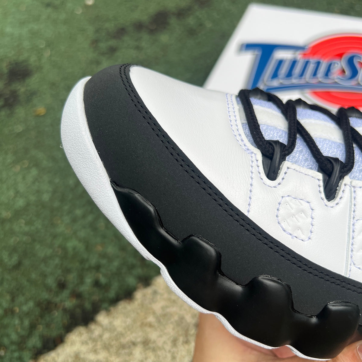 Nike Air Jordan 9 Retro OG Space Jam sneakers in black with colorful accents and Jumpman logo, showcasing the classic design.