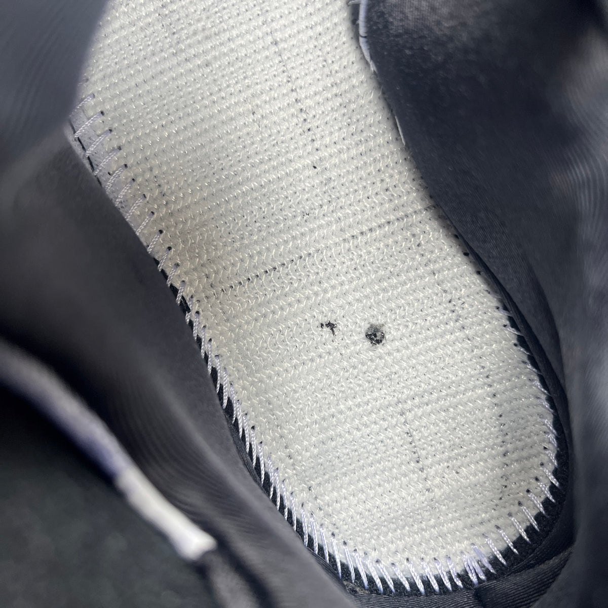 Nike Air Jordan 9 Retro OG Space Jam sneakers in black with blue accents, featuring the iconic Jumpman logo and space-themed design.