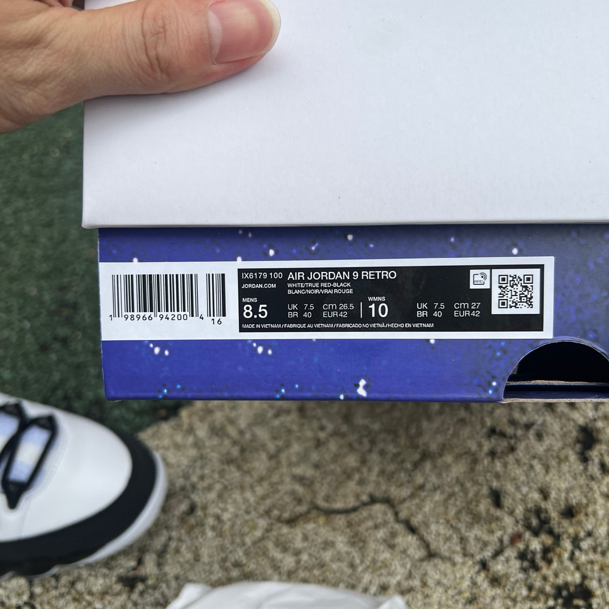 Nike Air Jordan 9 Retro OG Space Jam sneakers in white, black, and blue with Jumpman logo, showcasing the iconic design.
