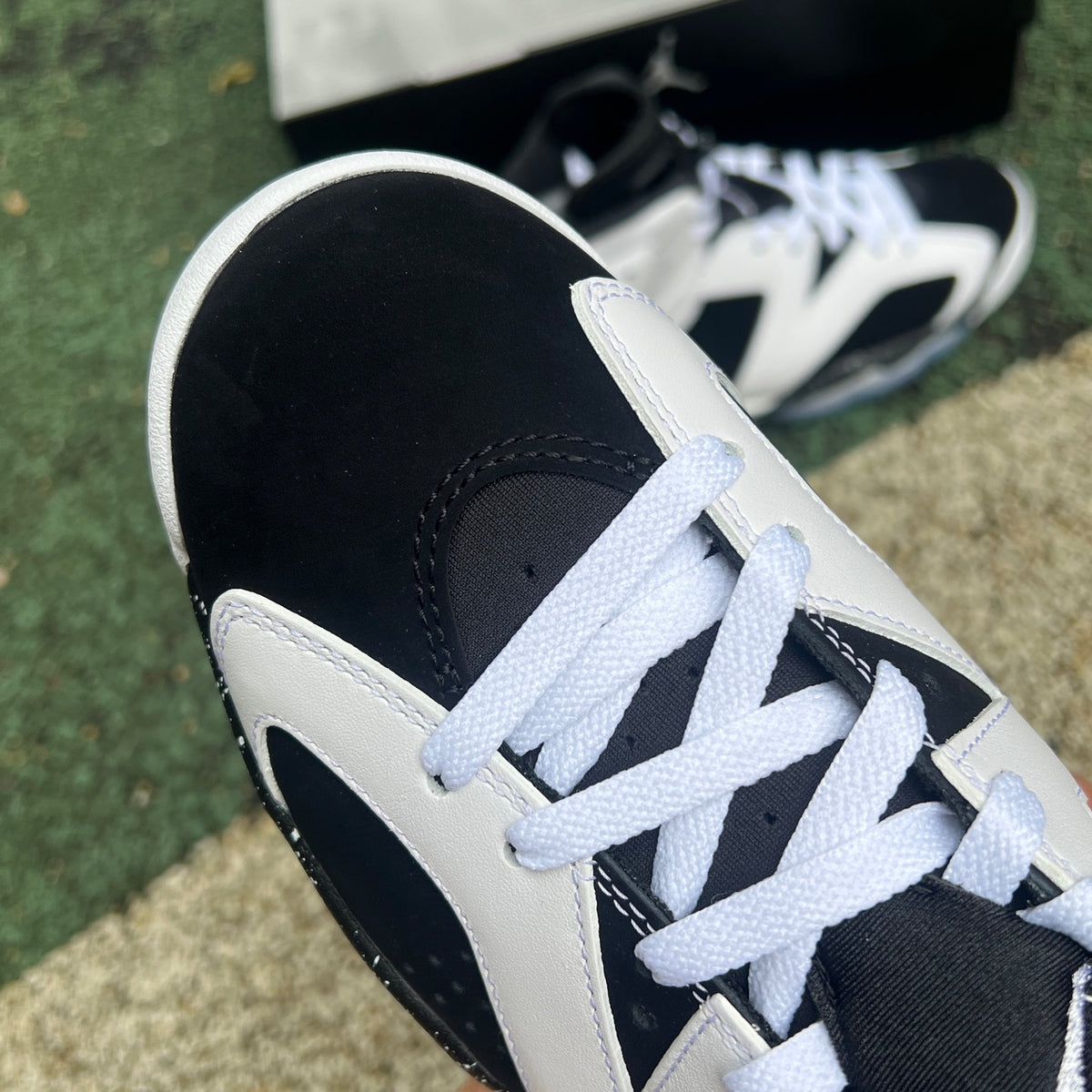 Nike Air Jordan 6 Retro Oreo sneakers in black and white with a sleek design, featuring the distinctive Jordan branding.