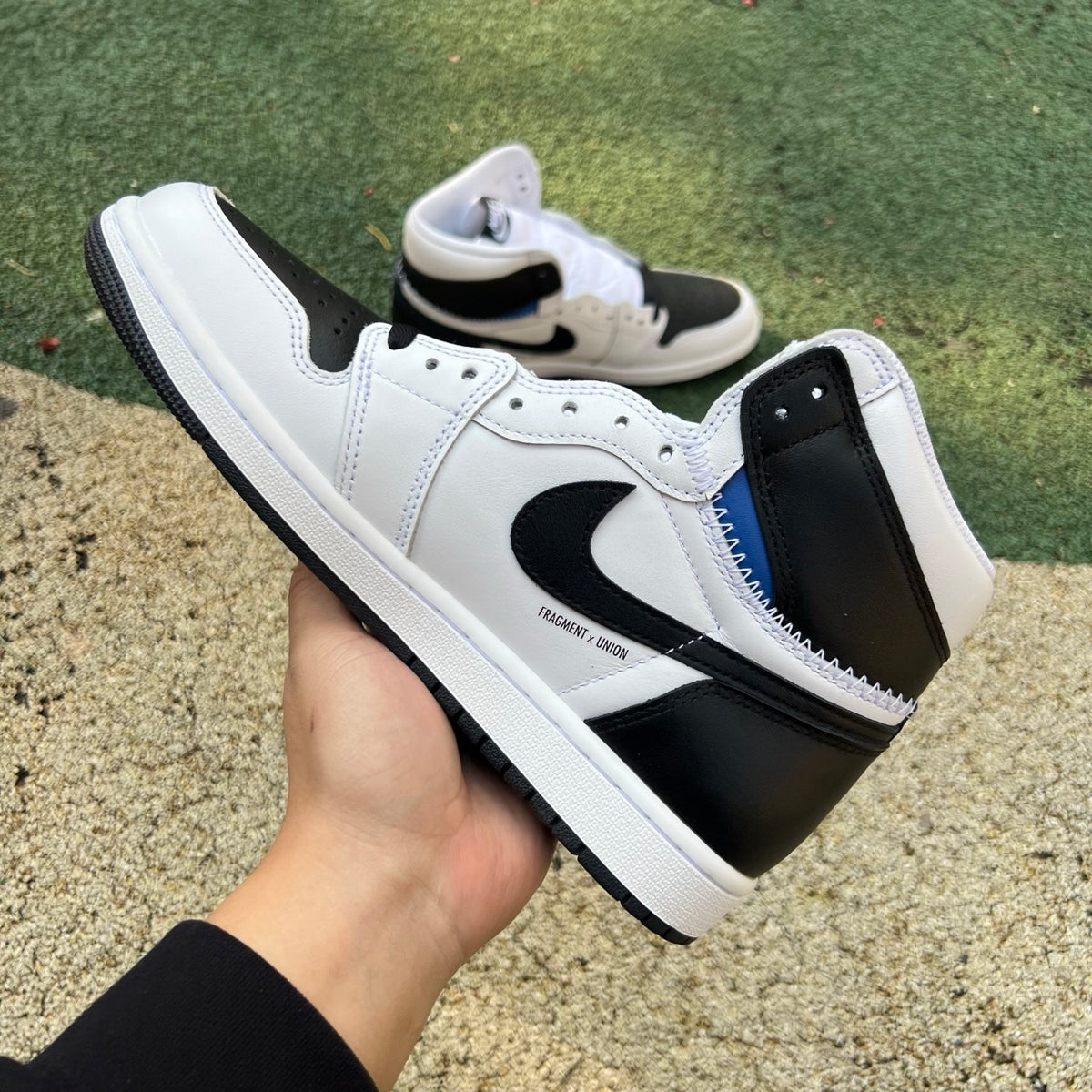 Nike Air Jordan 1 Retro High OG SP Fragment x Union LA sneakers in white and black, featuring iconic design and collaboration details.