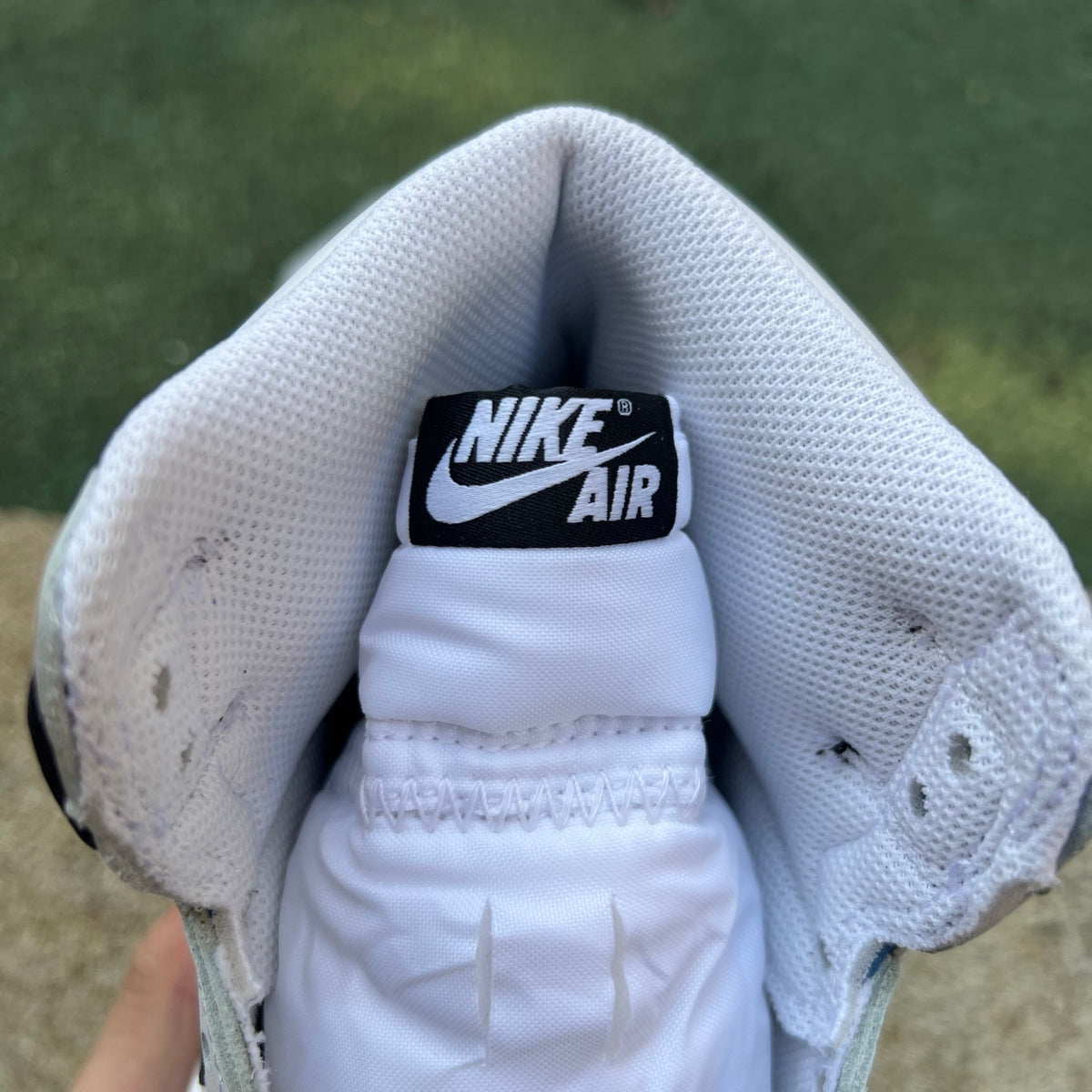 Nike Air Jordan 1 Retro High OG SP Fragment x Union LA sneakers in white and black, featuring iconic design details.