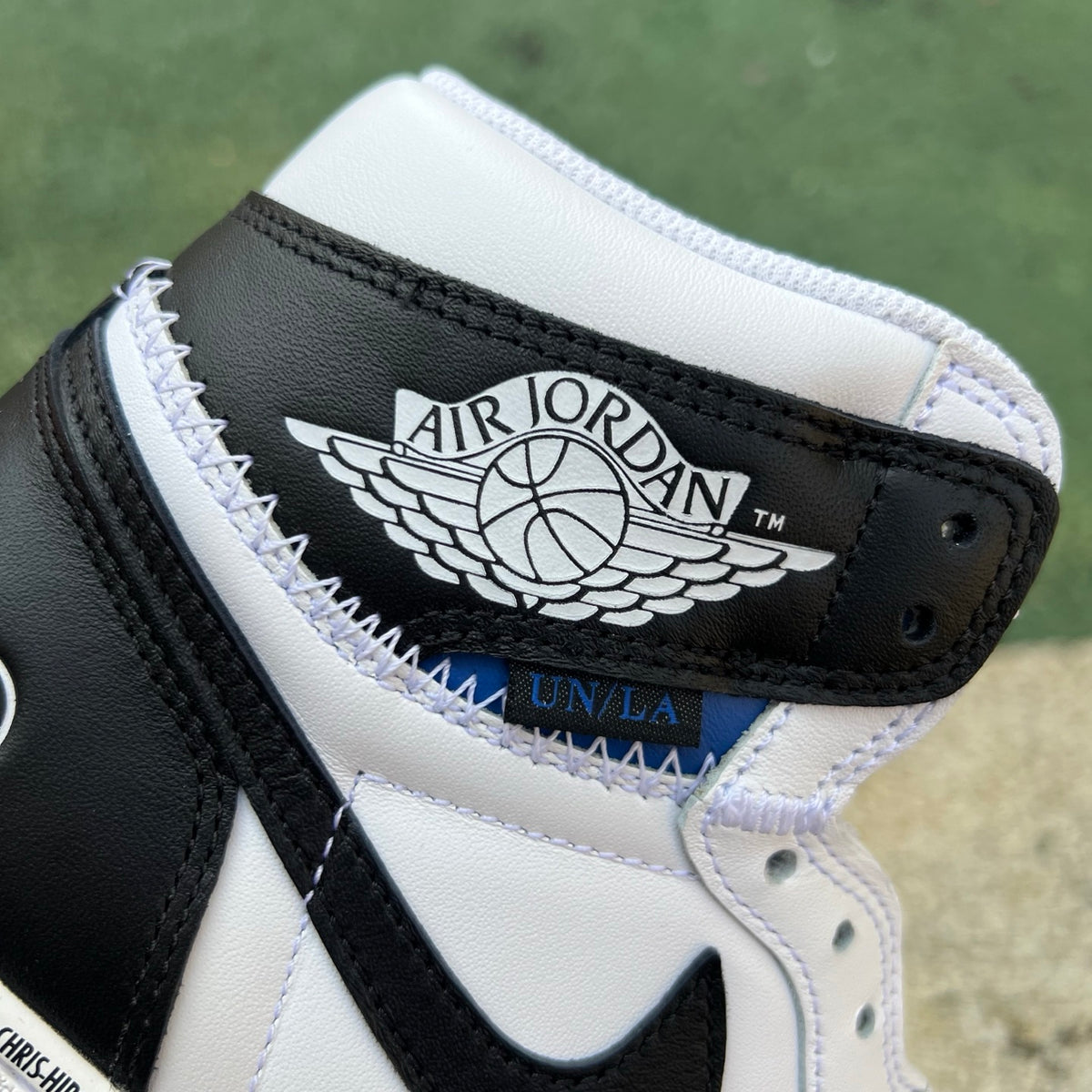 Nike Air Jordan 1 Retro High OG SP Fragment x Union LA sneakers in white and black, featuring iconic design details.