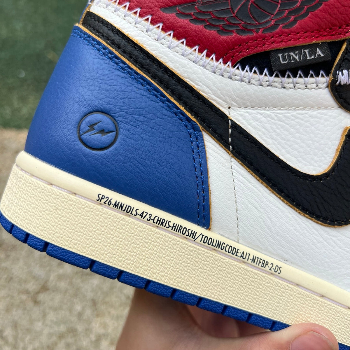 Nike Air Jordan 1 Retro High OG SP Fragment x Union LA sneakers in Varsity Red and Royal Blue showing side view