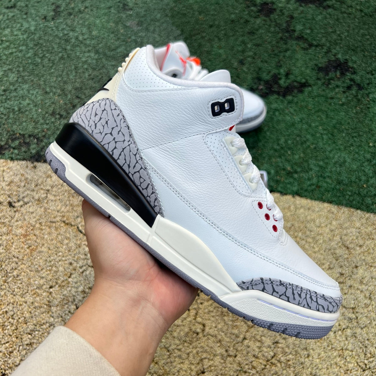 Nike Air Jordan 3 Retro White Cement Reimagined kids' sneaker with white leather, grey accents, and signature elephant print details.