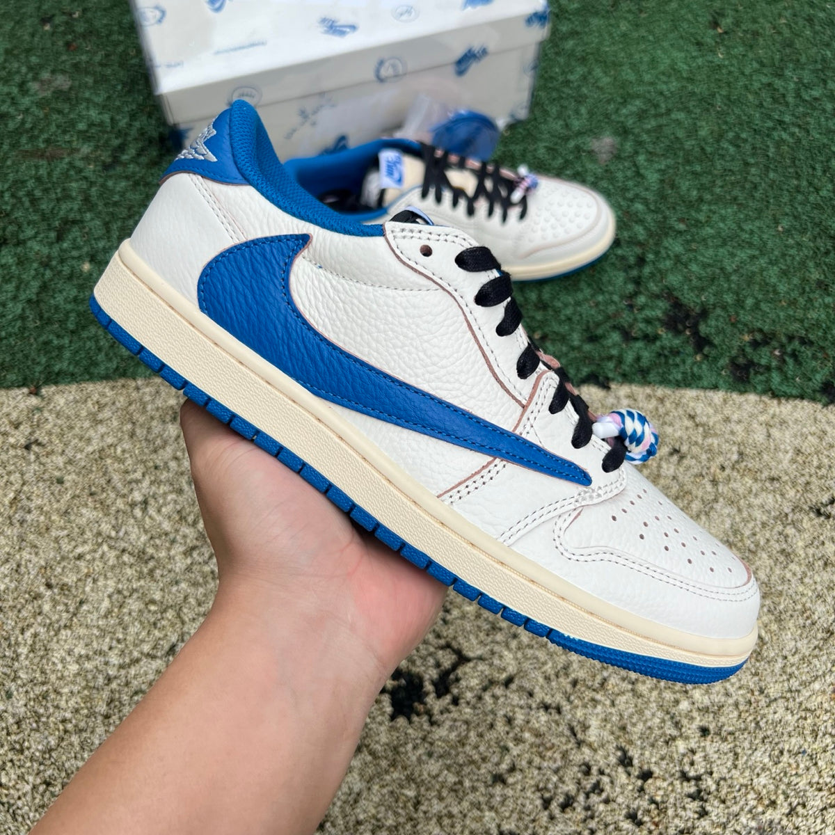 Nike Air Jordan 1 Retro Low OG SP Fragment x Travis Scott sneakers in Sail and Military Blue, featuring iconic design details.