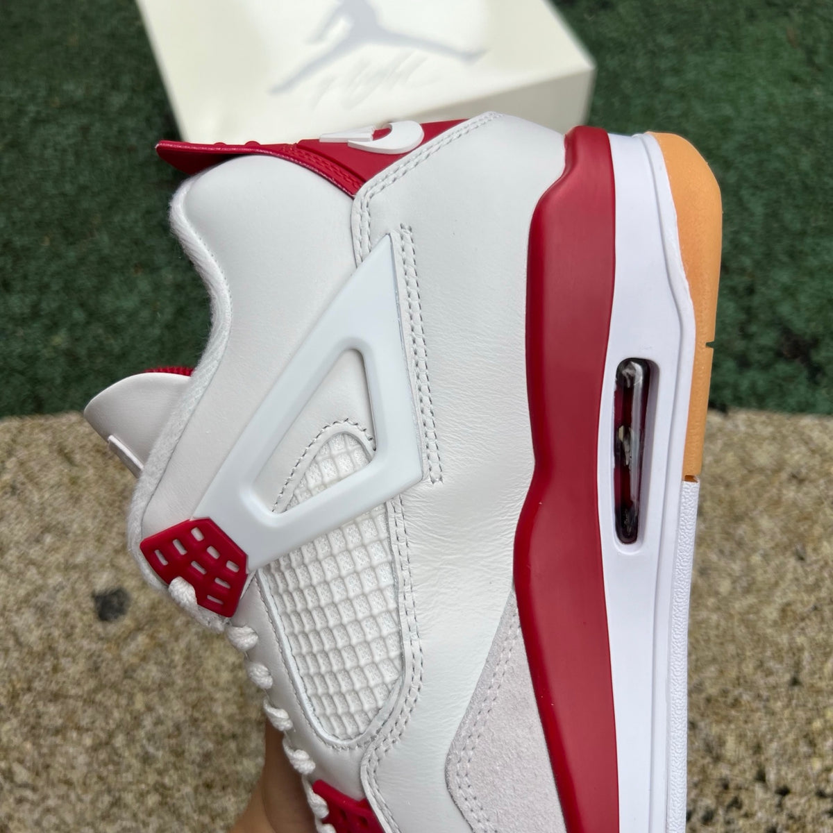 Nike Air Jordan 4 Retro SB Varsity Red sneakers featuring red and black colorway, leather upper, and signature design details.