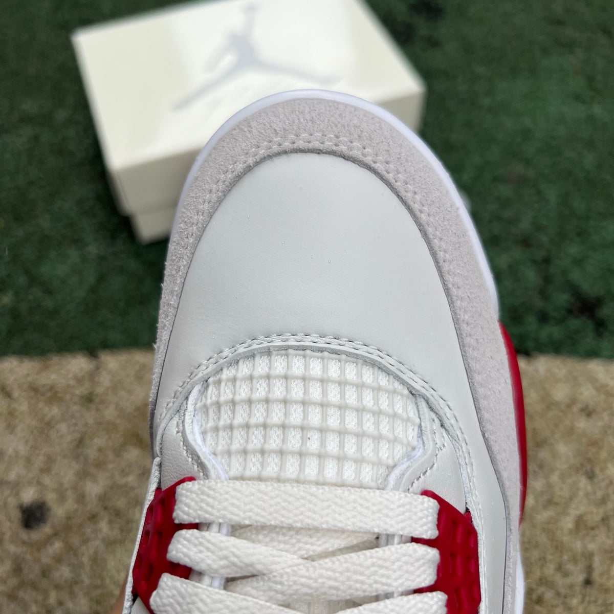 Nike Air Jordan 4 Retro SB Varsity Red sneakers, featuring red and black color scheme, detailed with visible Air cushioning and stylish design
