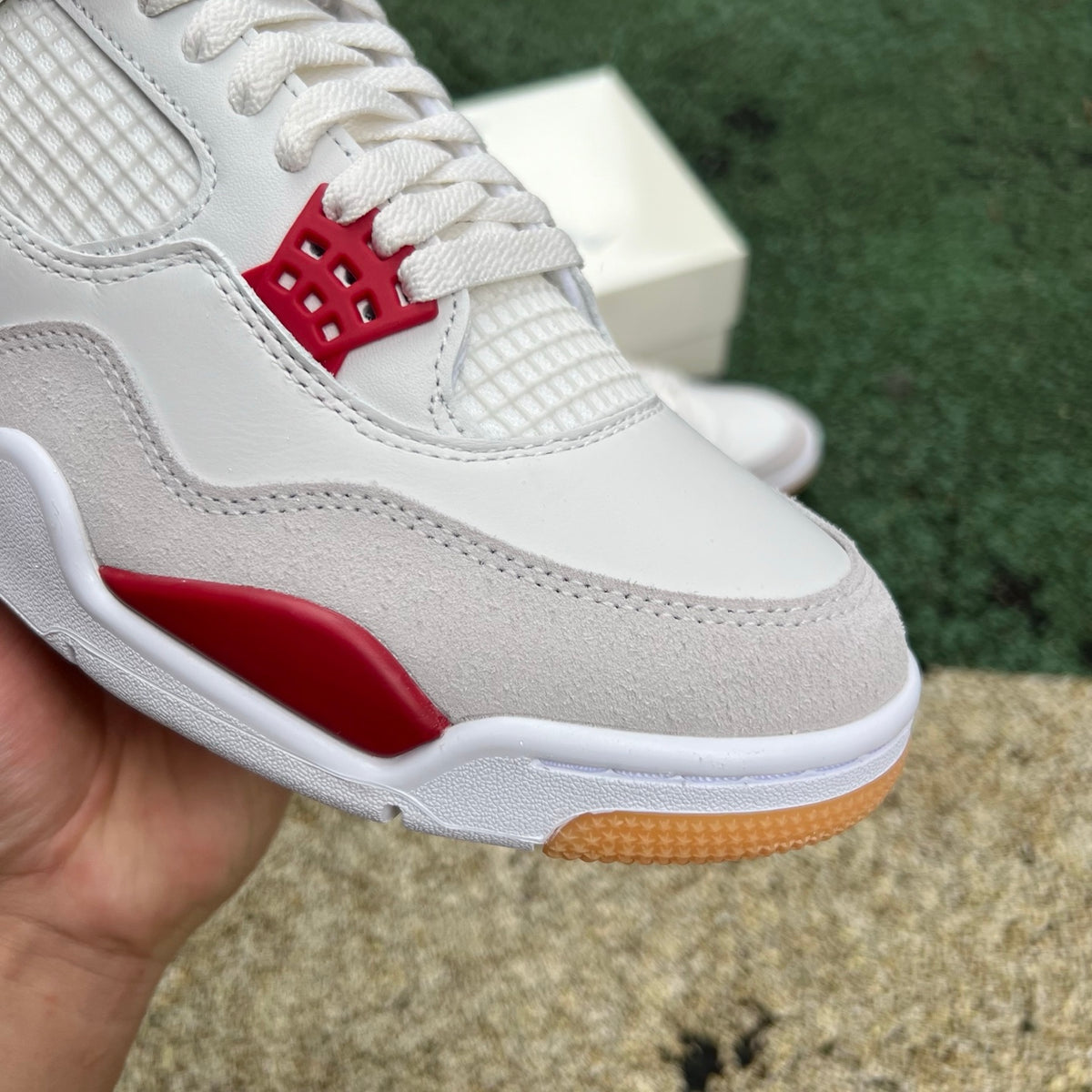 Nike Air Jordan 4 Retro SB Varsity Red sneakers, showcasing red and black colorway with classic design details.