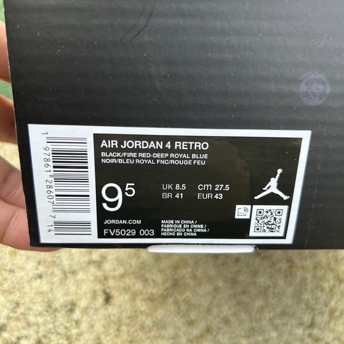 Nike Air Jordan 4 Retro Rare Air sneakers with white lettering, featuring classic design and Nike x Jordan branding