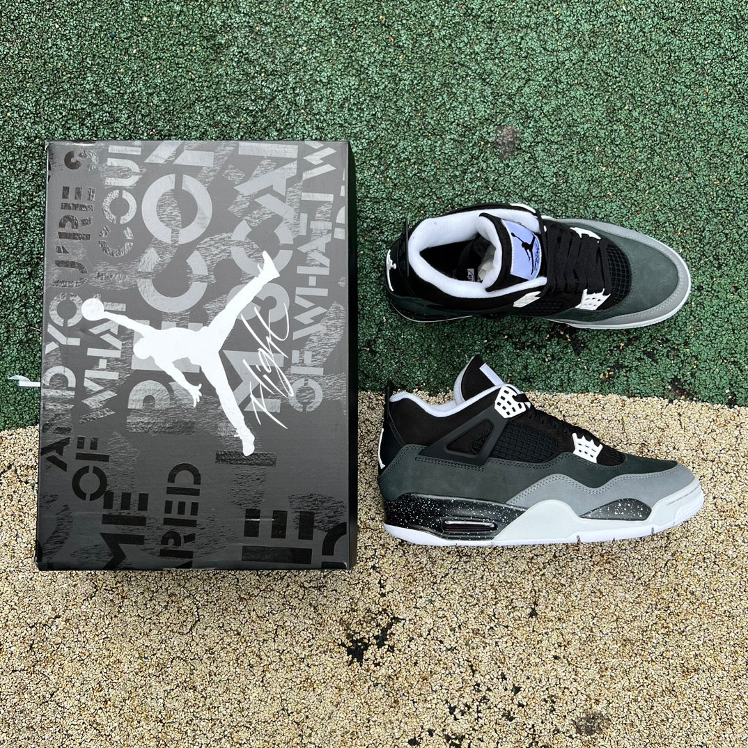 Nike Air Jordan 4 Retro Fear sneakers in black and gray with orange accents, showcasing the iconic design and premium materials.