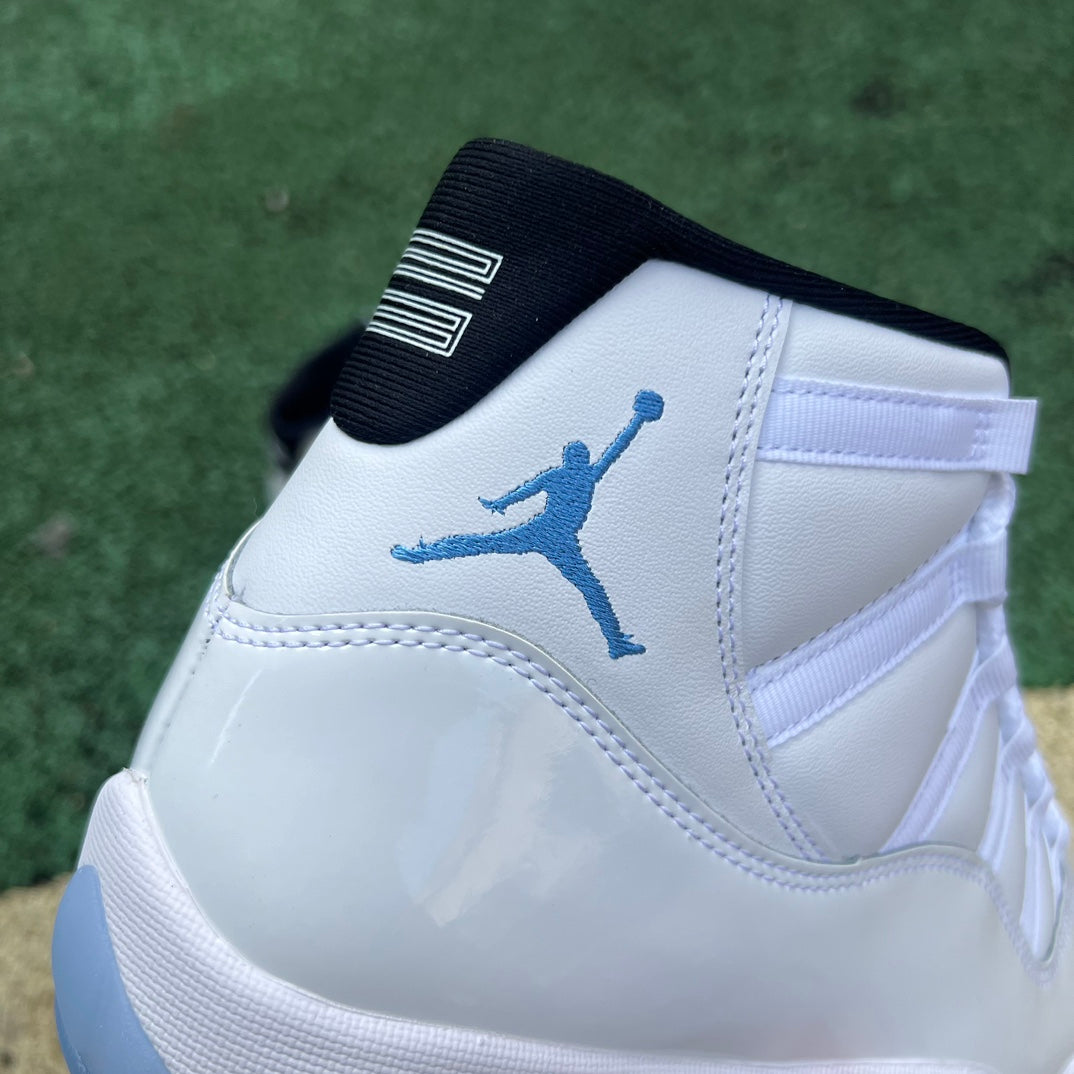 Nike Air Jordan 11 Retro Legend Blue sneakers in white and blue with patent leather and Jumpman logo details.