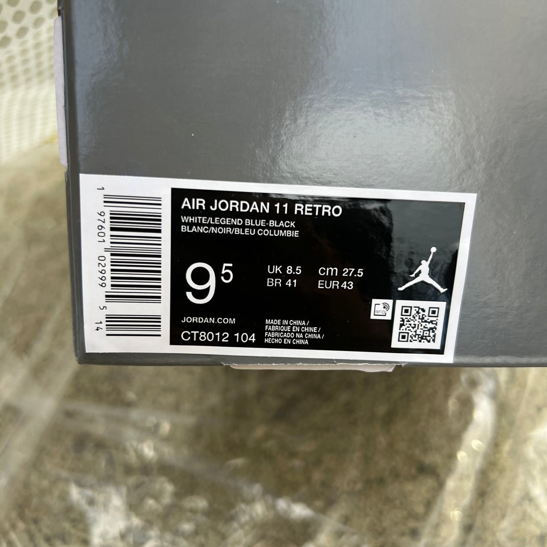 Nike Air Jordan 11 Retro Legend Blue sneakers in white and blue with patent leather accents, front view.
