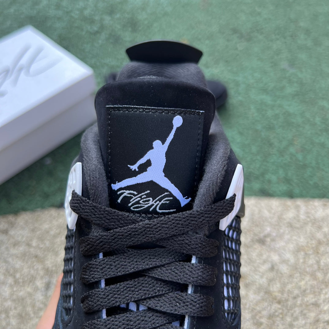 Nike Air Jordan 4 Retro White Thunder sneakers with white and yellow accents, showcasing the classic basketball shoe design.