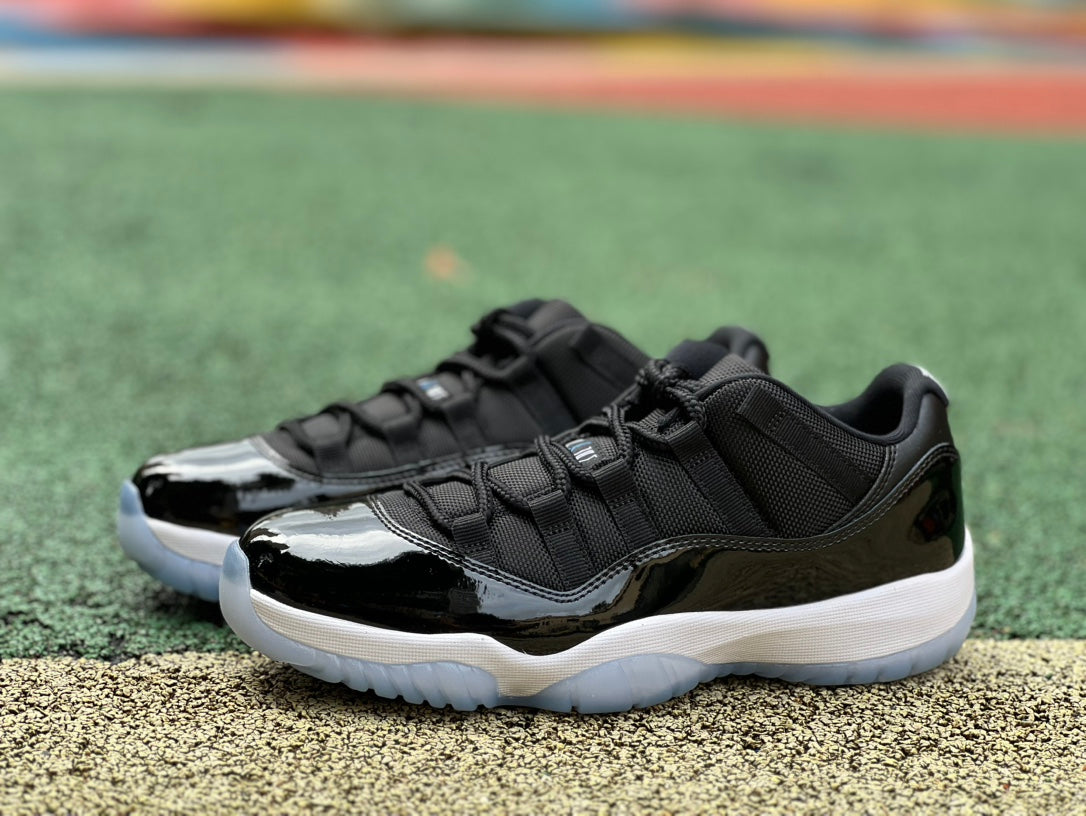 Nike Air Jordan 11 Retro Low Space Jam sneakers in black and blue, featuring patent leather and Jumpman logo details.