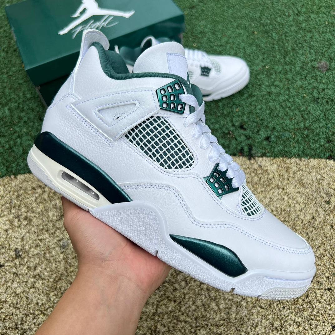 Nike Air Jordan 4 Retro Oxidized Green sneakers, side view showing green and gray colorway with signature design details