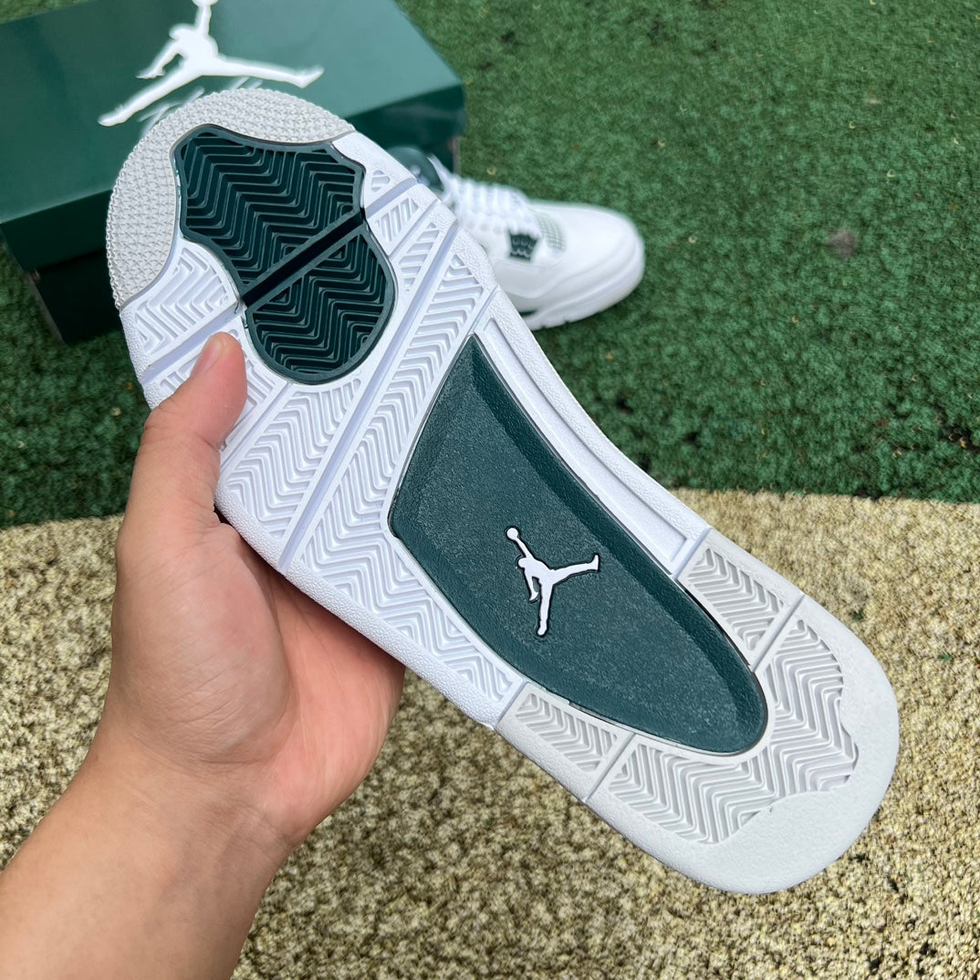 Nike Air Jordan 4 Retro Oxidized Green sneakers featuring a green and black colorway with detailed design elements.
