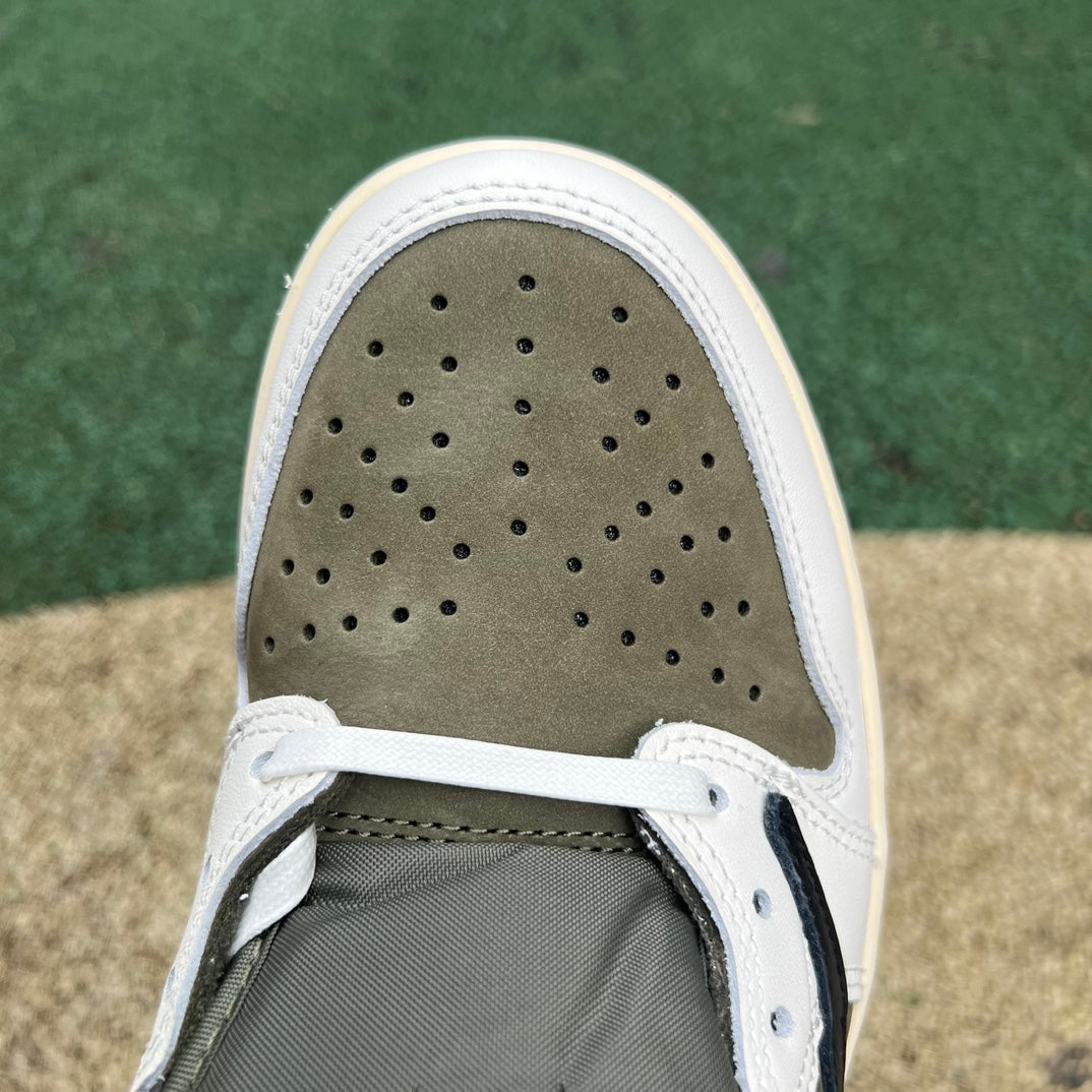 Nike Air Jordan 1 Retro Low OG SP Travis Scott sneakers in Medium Olive, featuring signature design and brand details.