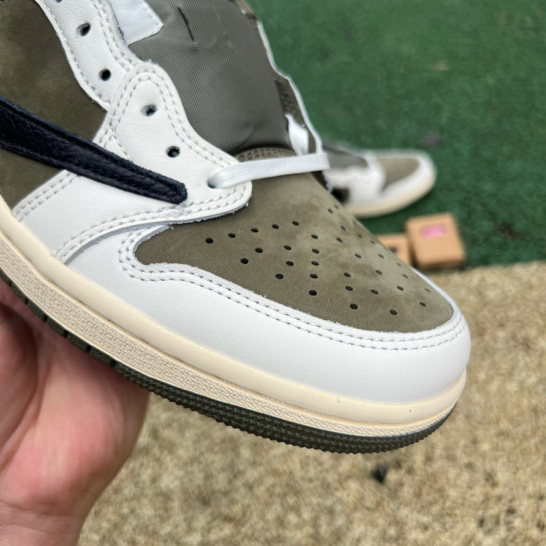 Nike Air Jordan 1 Retro Low OG SP Travis Scott sneakers in medium olive, featuring classic design and signature branding.