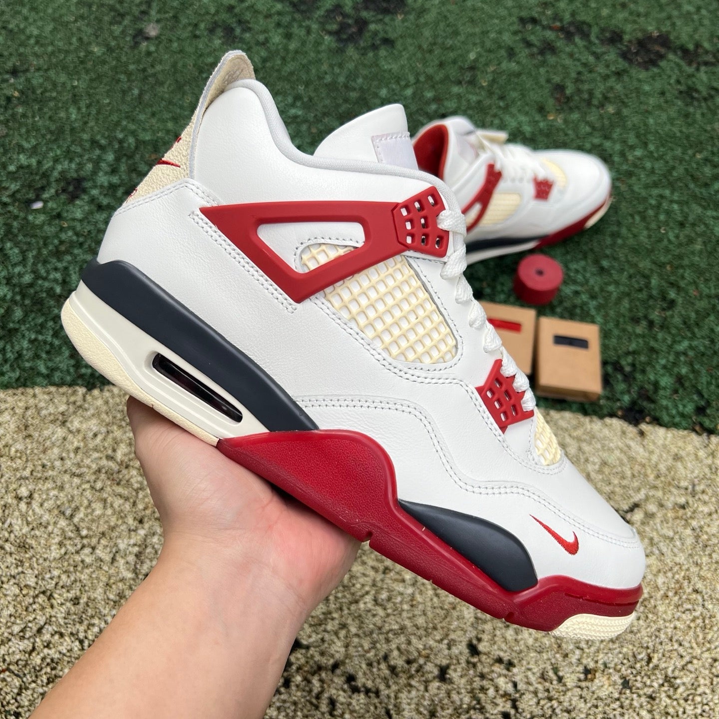 Nike Jordan 4 Retro OG Nigel Sylvester Brick sneaker, side view showcasing the classic design and vibrant brick colorway.