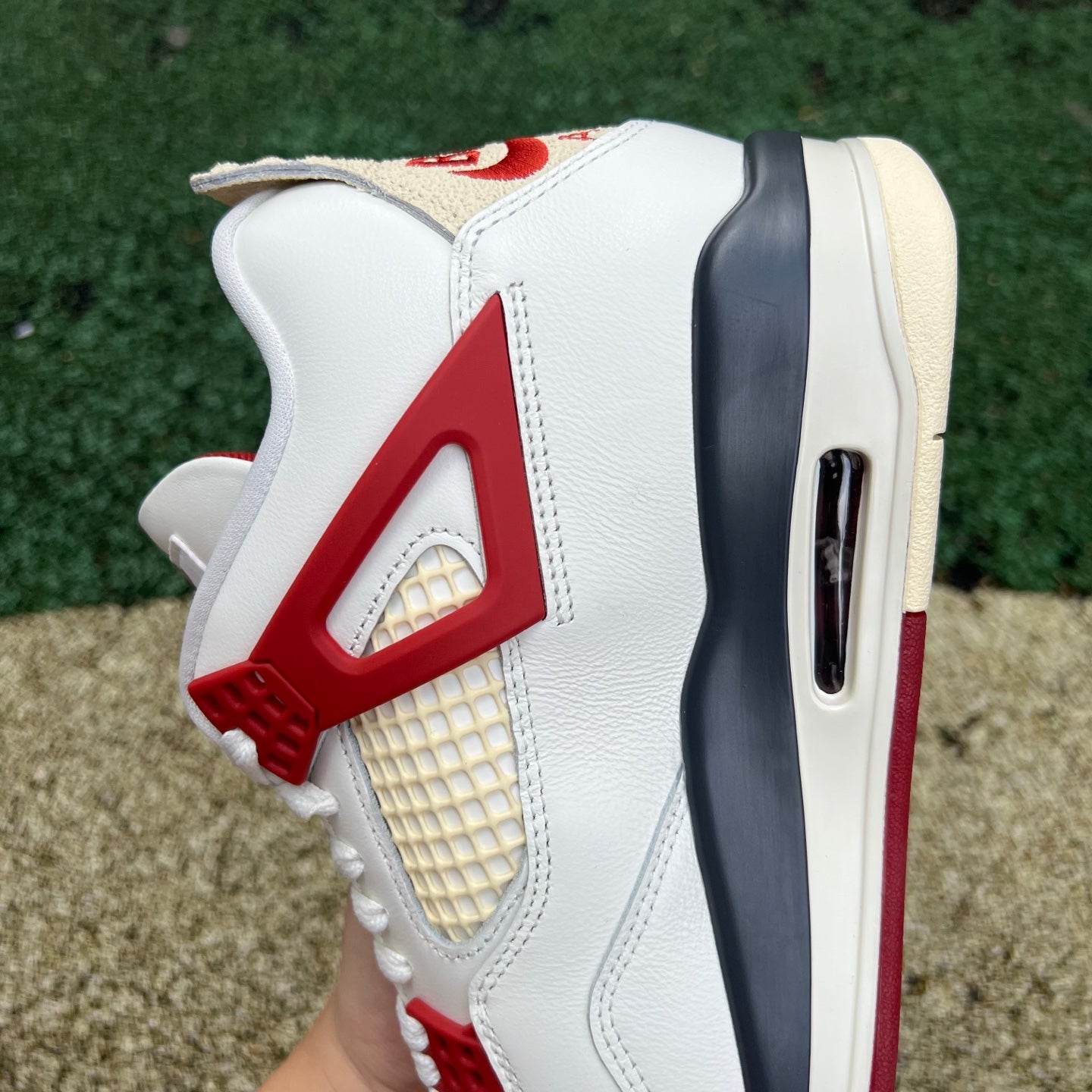 Nike Jordan 4 Retro OG Nigel Sylvester Brick sneakers featuring a classic design and bold brick colorway.