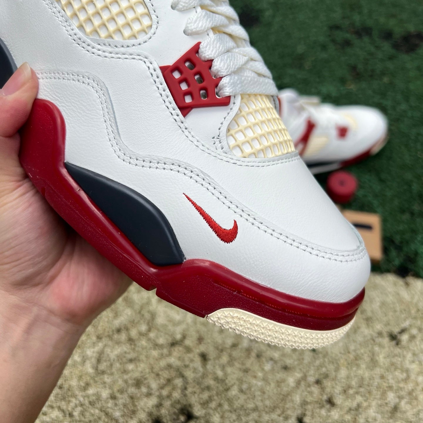 Nike Jordan 4 Retro OG Nigel Sylvester Brick After Brick sneakers in white with red accents and textured details.