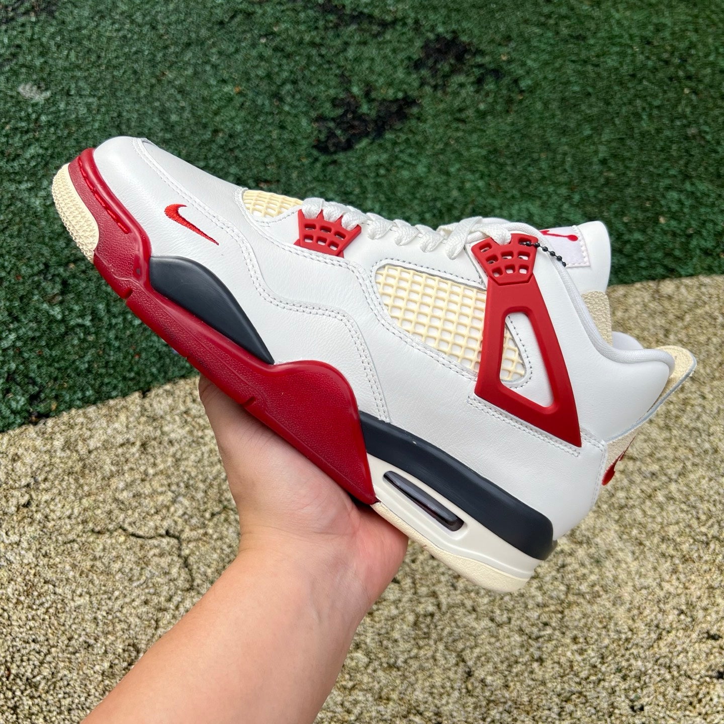 Nike Jordan 4 Retro OG Nigel Sylvester Brick sneakers featuring a classic design with red brick accents and premium materials.