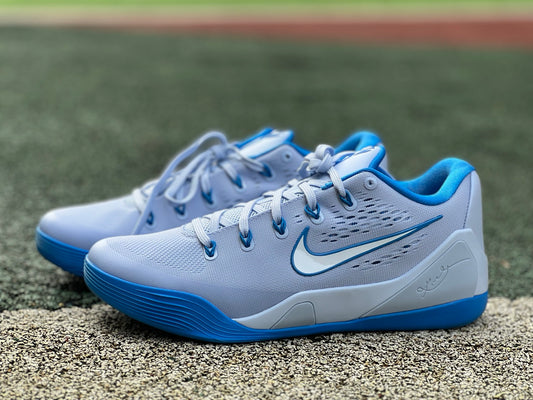Nike Kobe 9 EM Low Protro basketball shoes in hydrogen blue with black accents, showcasing the athletic design and Nike branding.