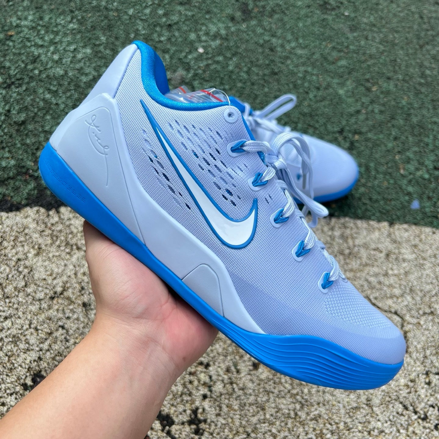 Nike Kobe 9 EM Low Protro TB Hydrogen Blue basketball sneakers, featuring blue and black design details.
