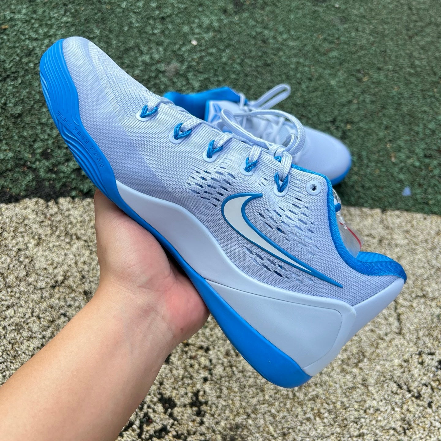 Nike Kobe 9 EM Low Protro TB Hydrogen Blue basketball shoes with blue and black design, featuring Nike and Jordan branding.