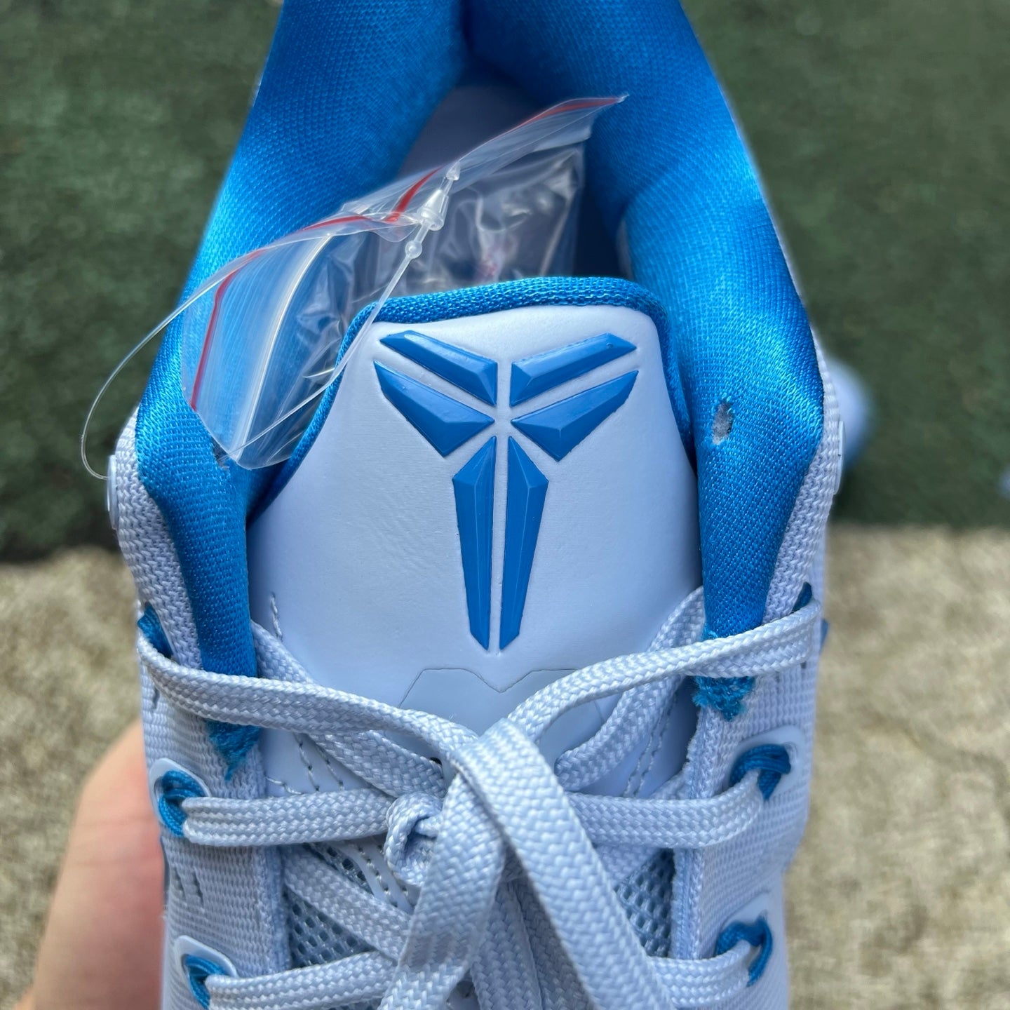 Nike Kobe 9 EM Low Protro TB Hydrogen Blue basketball shoes, featuring blue and black design with Nike branding.