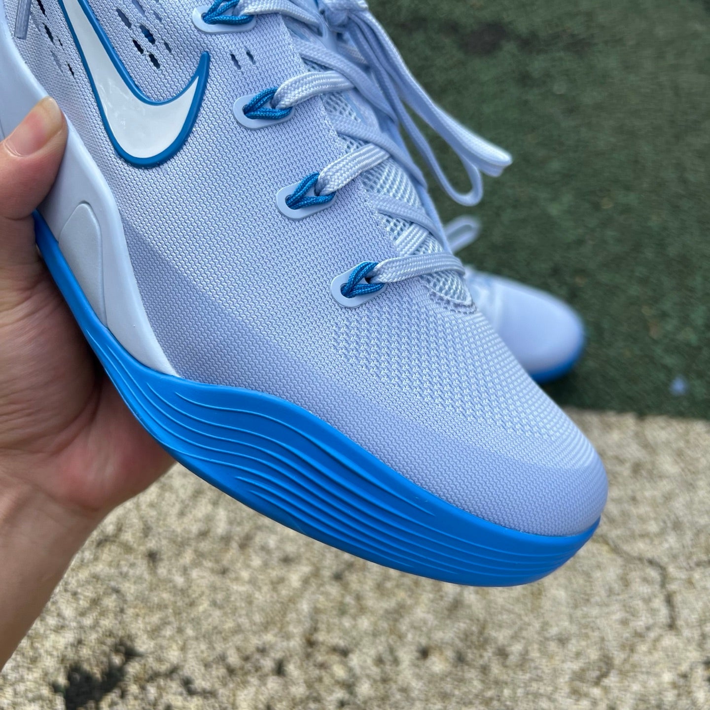 Nike Kobe 9 EM Low Protro basketball shoes in hydrogen blue with black accents, featuring sleek design and signature Nike branding.