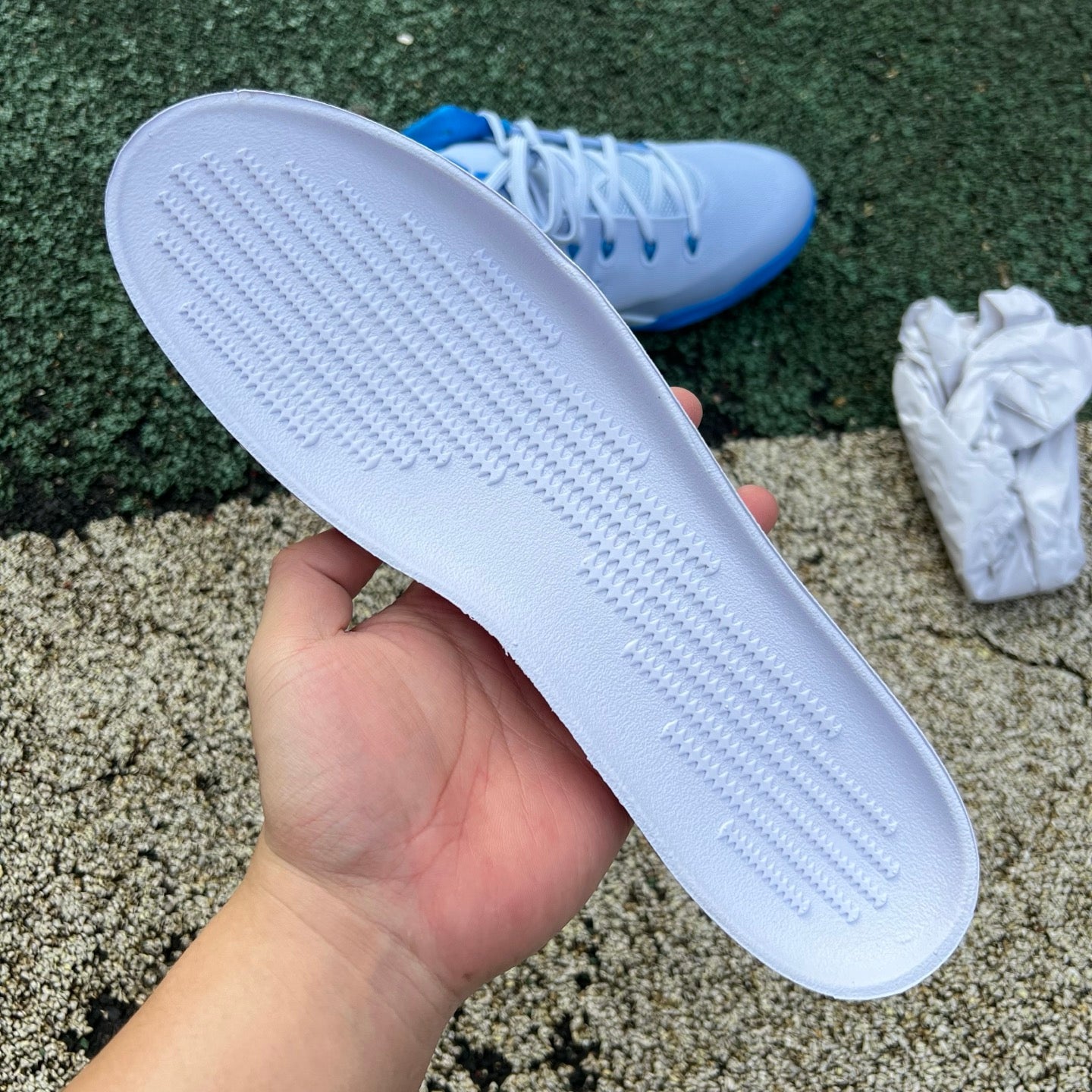 Nike Kobe 9 EM Low Protro TB Hydrogen Blue basketball shoes with blue and black accents, featuring a sleek low-top design.