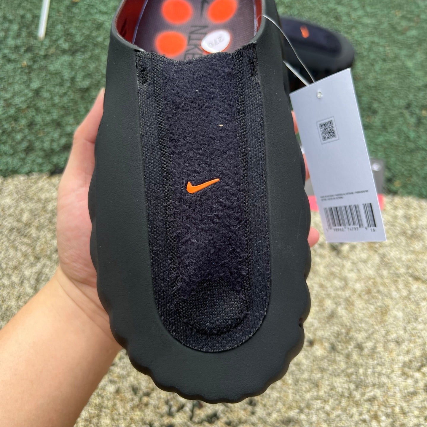 Nike x Jordan Mind 001 Flyknit Slide in bronze eclipse and total orange with Nike branding, shown on a plain background.