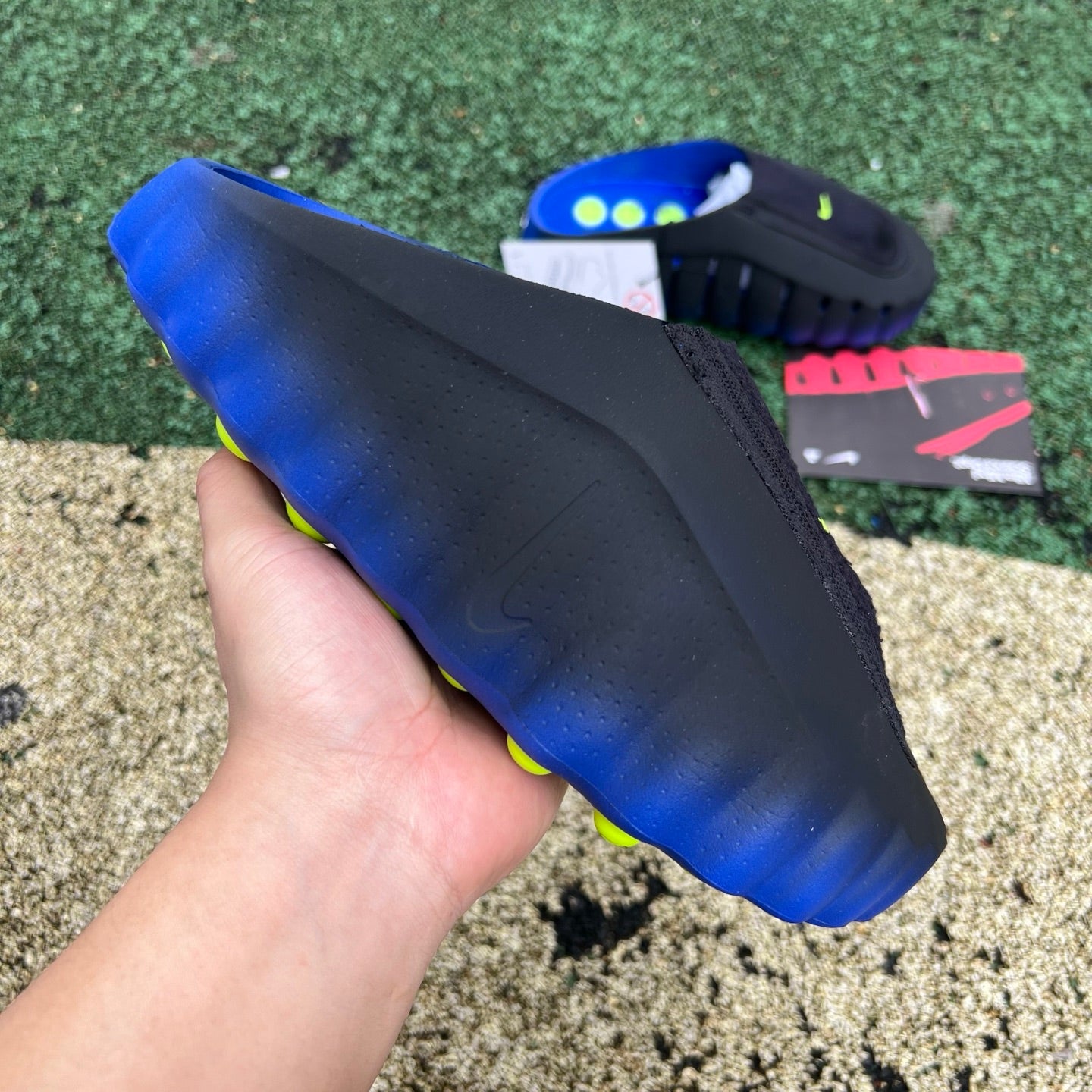 Nike x Jordan Mind 001 Flyknit Slide in Hyper Royal and Black, featuring a sleek Nike and Jordan branding design.