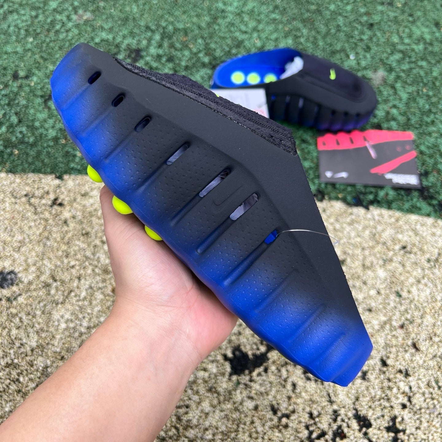Nike Mind 001 Flyknit Slide in Hyper Royal and Black, featuring Nike x Jordan branding and a comfortable slip-on design.