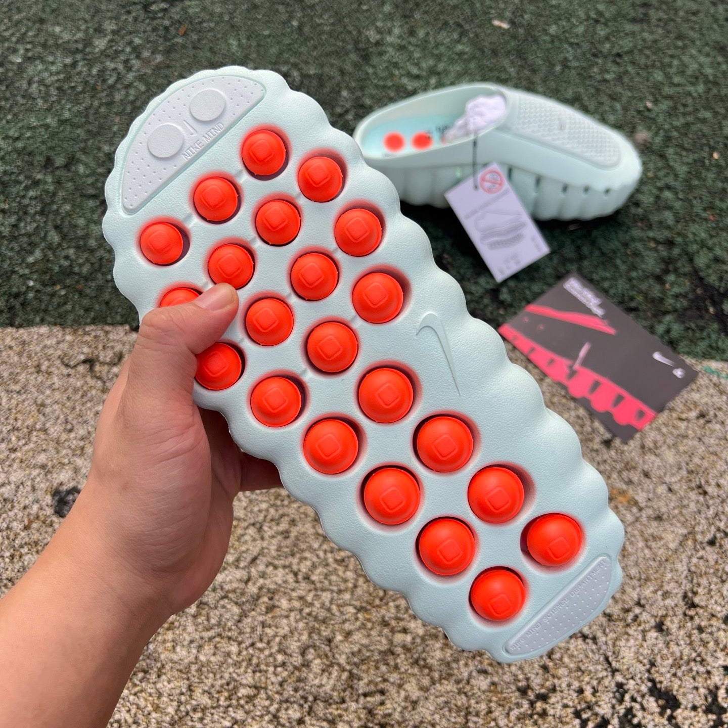 Nike x Jordan Mind 001 Slide Barely Green sandal with Nike branding and open-toe design, featuring a green strap and textured sole.