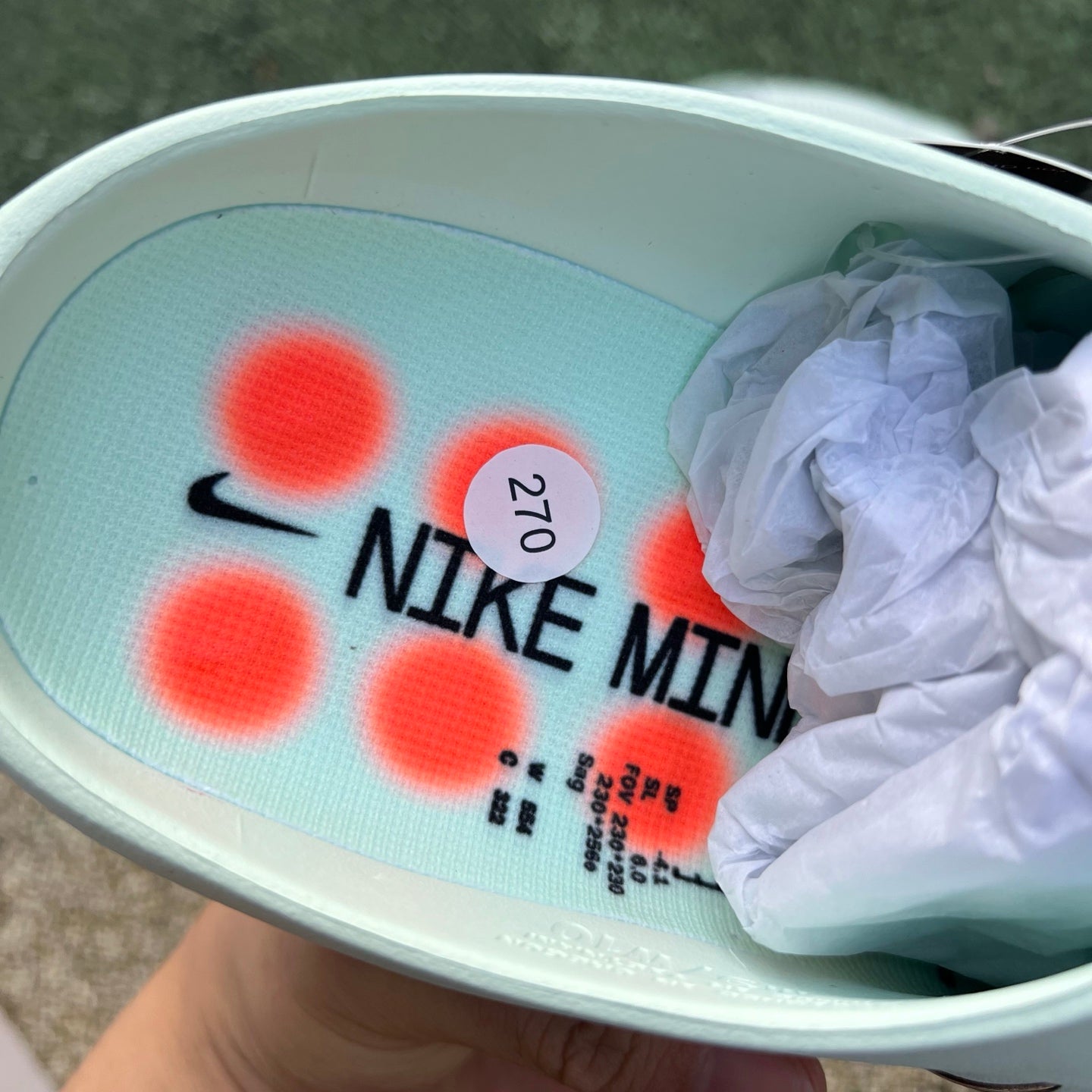 Nike x Jordan Mind 001 slide in barely green with black and white accents, featuring a cushioned sole and open toe design.