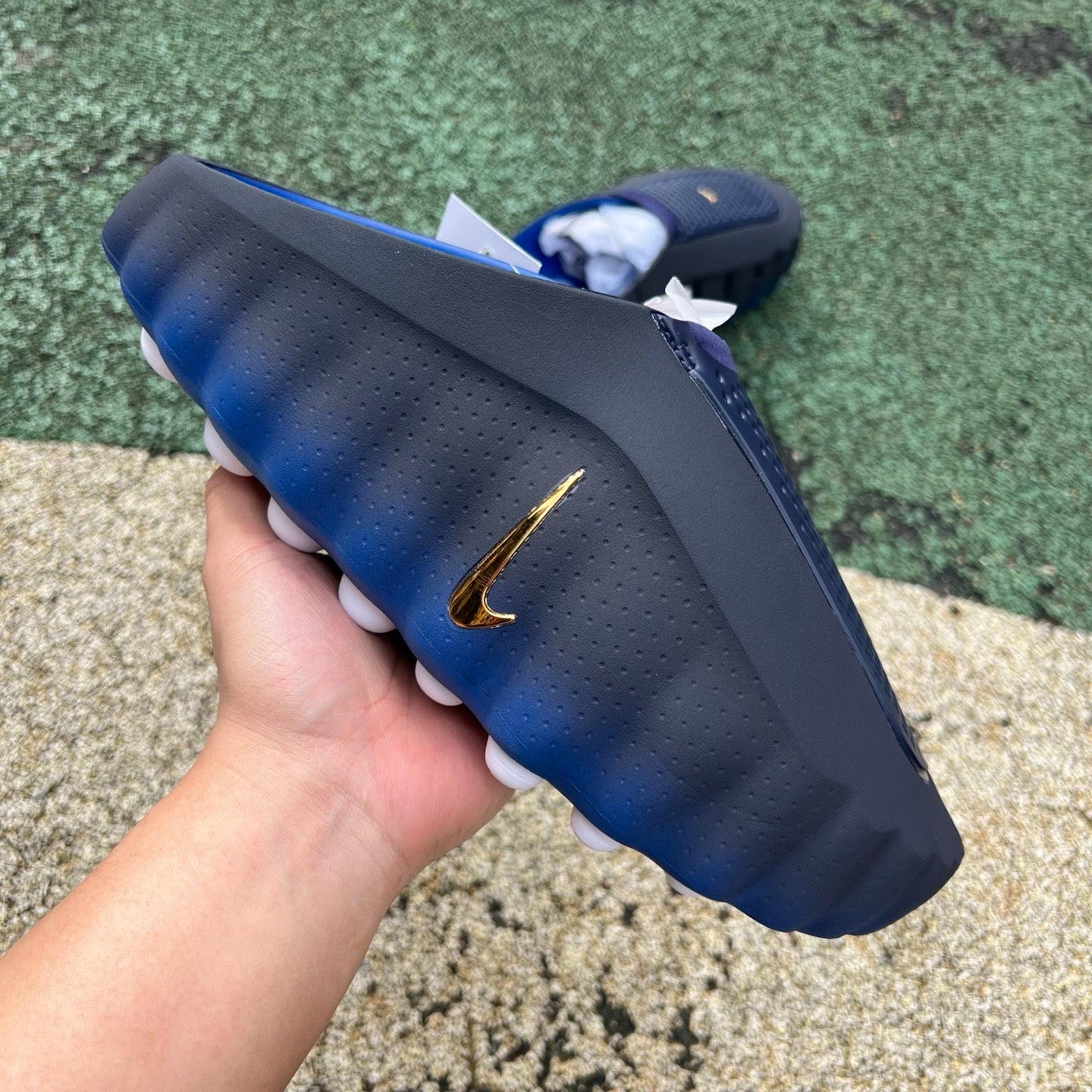 Nike x Jordan Mind 001 slide in blackened blue and game royal, featuring a sleek design with Nike and Jordan branding.