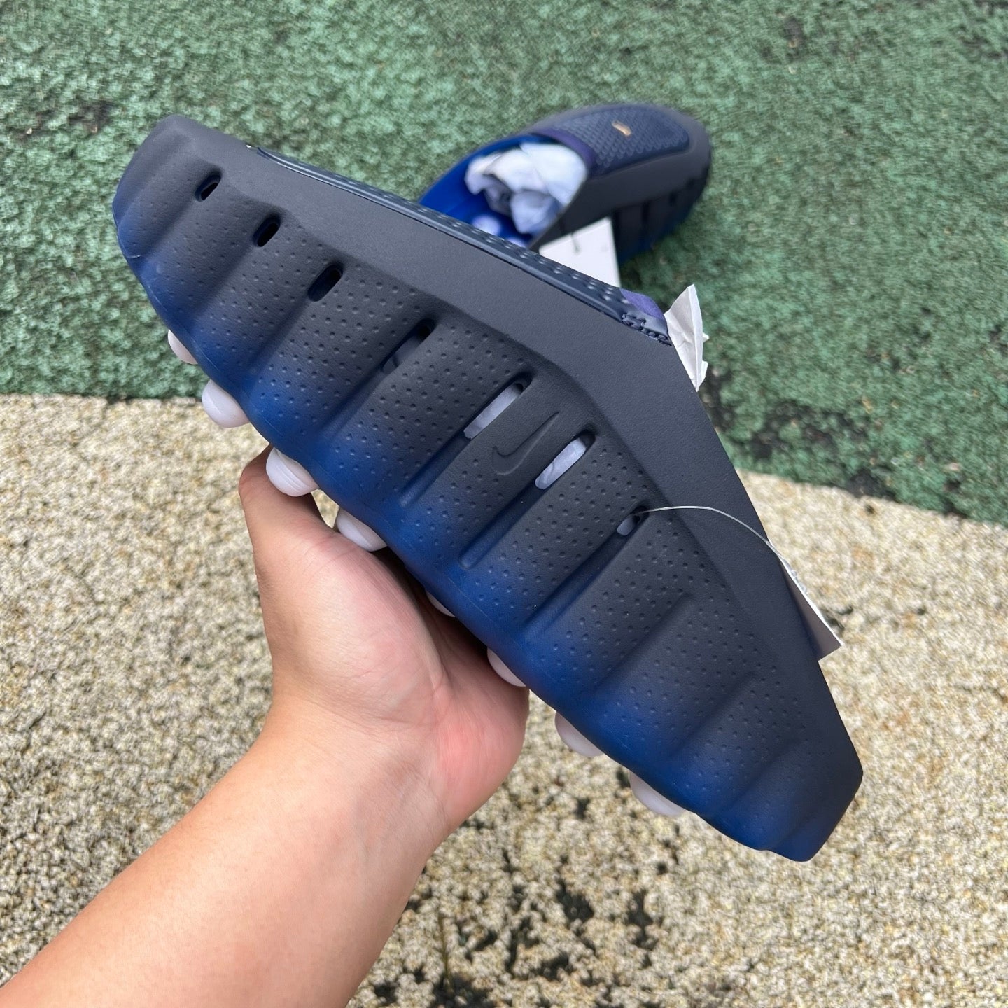 Nike Mind 001 slide in blackened blue and game royal, featuring Nike x Jordan branding and comfortable slip-on design.