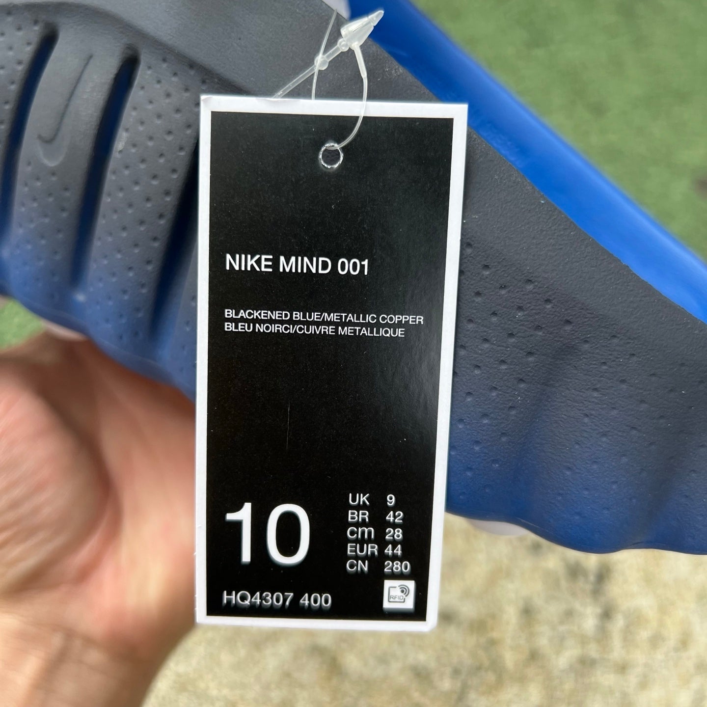 Nike x Jordan Mind 001 slide in blackened blue and royal, featuring a comfortable slip-on design and sporty branding.