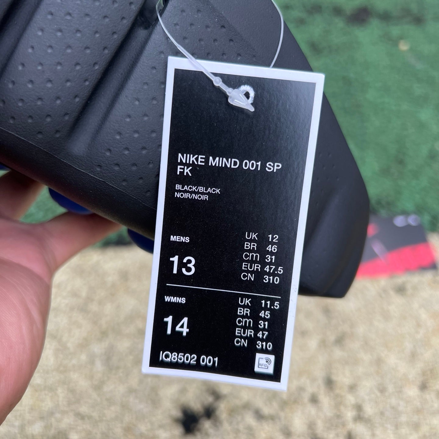 Nike x Jordan Mind 001 Slide in black with white branding, featuring a comfortable slip-on design and cushioned sole.
