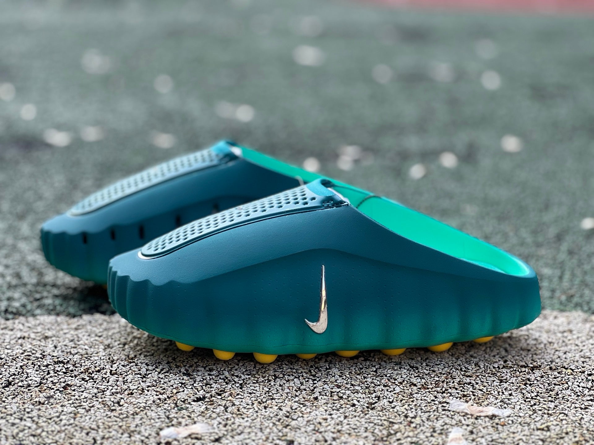 Nike Mind 001 Slide in Geode Teal and Light Menta with Jordan branding, featuring a comfortable slip-on design and textured sole.