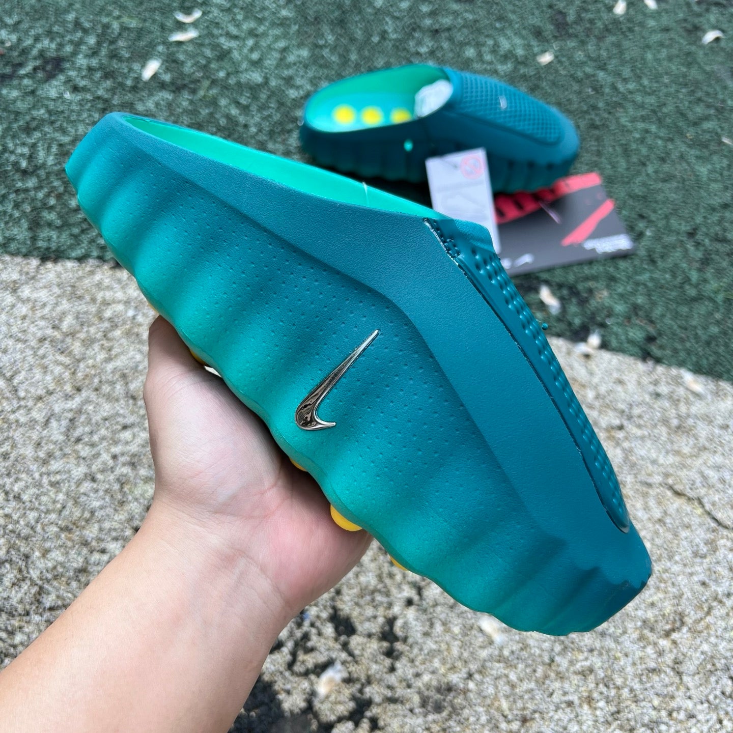 Nike Mind 001 slide in Geode Teal and Light Menta with Jordan branding, featuring a comfortable slip-on design and sporty style.