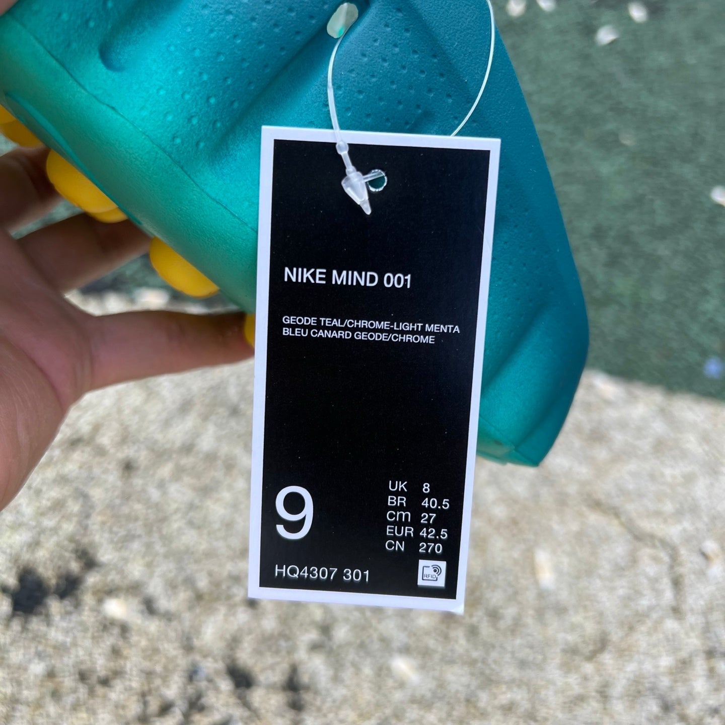 Nike x Jordan Mind 001 slide in Teal Light Menta with geometric design, featuring Nike branding and comfortable slip-on style.